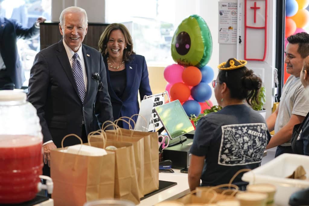 President Joe Biden and Vice President Kamala Harris arrive to pick up an order from Taqueria Habanero restaurant on Friday, May 5, 2023, in Washington. (AP Photo/Evan Vucci)